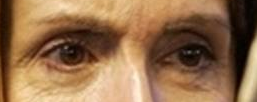 A close up of a person's eyes

Description automatically generated